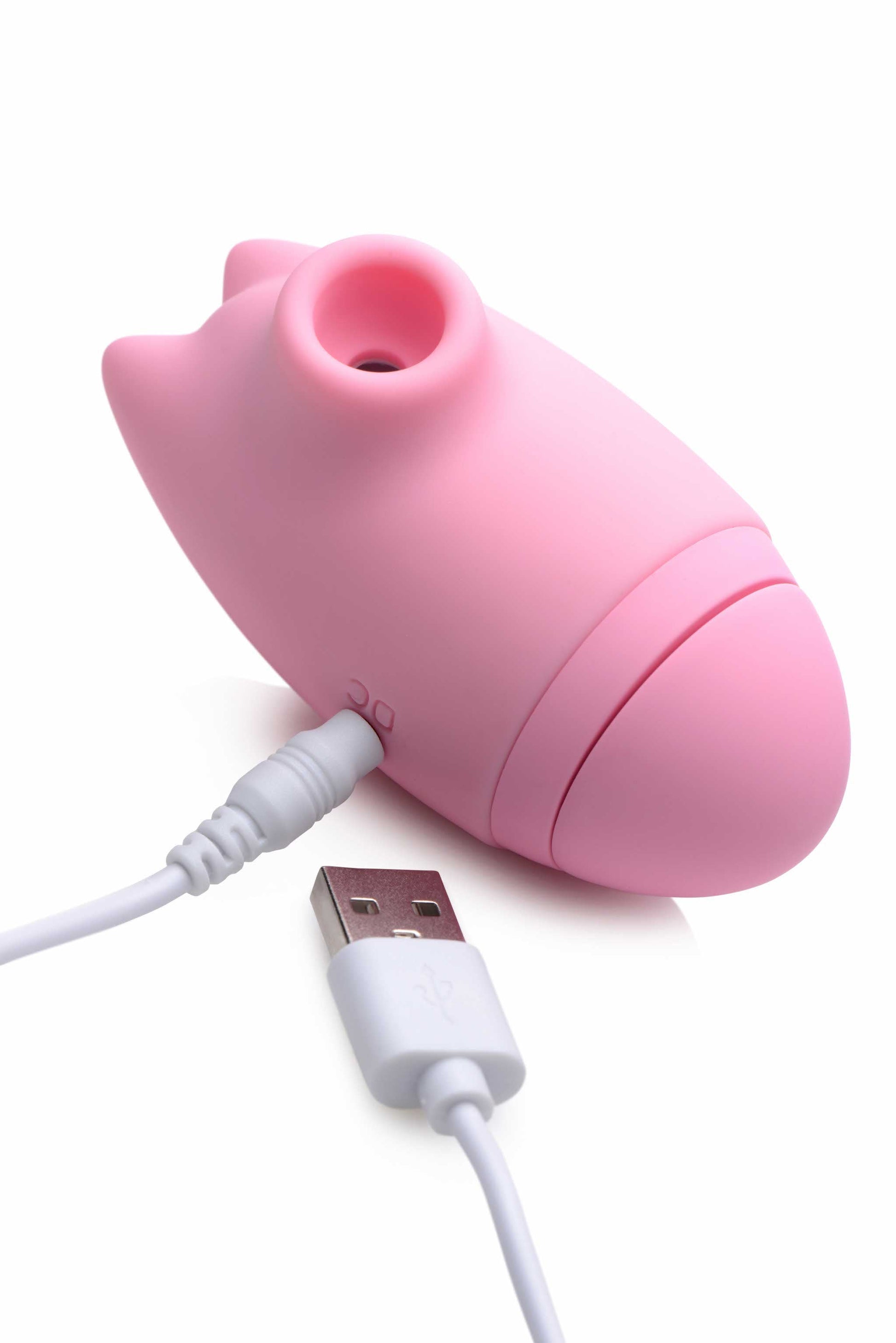 close-up of the charging of the inmi shegasm kitty licker 5x silicone rechargeable clit stimulator pink xr-ag628