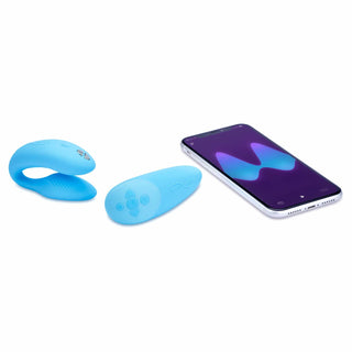 a smartphone laying next to the we-vibe chorus couples remote control vibrator vibe wvsnw6sg5 blue
