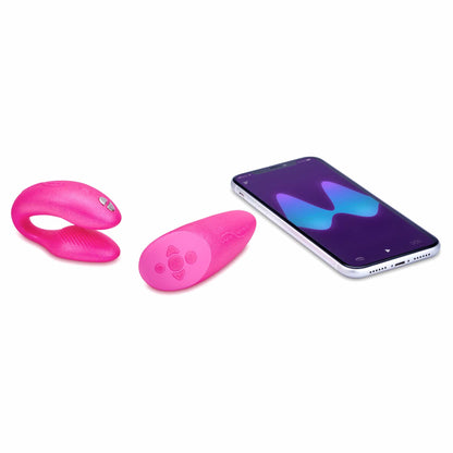 a smartphone laying next to the we-vibe chorus couples remote control vibrator vibe wvsnw6sg5 cosmic pink