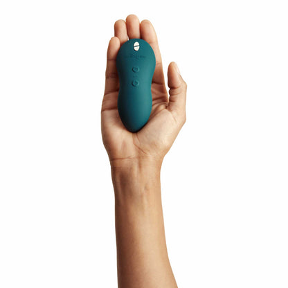 person holding the we-vibe touch x powerful mini massager wvsntcsg6 green velvet